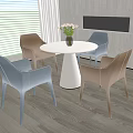 Modern White Round Table Set With Four Brown And Blue Chairs And Flower Vase