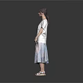 Woman in white T-shirt and colorful long skirt with sandals against gray background
