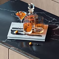 Stylish Wine Decanter And Cocktail Glasses On Tray With Marble Tabletop And Fruit Garnish