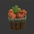 Colorful Cupcake With Red Rose Decorations And Green Leaf On Top