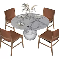 Round Marble Dining Table With Four Brown Chairs And Wooden Legs
