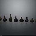 Colored Glass Bottles Neatly Arranged On Gray Background With Various Hues