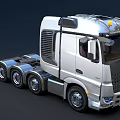 Modern Silver Tractor Unit With Tri Axle And Yellow Roof Lights