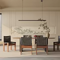 Modern Restaurant Interior With Round Dining Table Black Chairs Landscape Painting Plant And Hanging Lamp