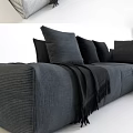 Modern Gray Sectional Sofa With Multiple Black Cushions And Soft Throw Blanket 3d model