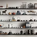 Decorative Ornament Set with Teapots Books Sculptures Vases and Small Plants on Shelves