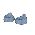 Two Blue Denim Bean Bag Chairs on Gray Marble Floor with Light Colored Wall