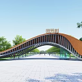 Curved Wooden Entrance Gate with Inscribed Top Surrounded by Trees and Open Square