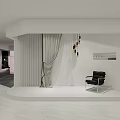 Modern Interior Display Area Featuring White Curved Wall Gray Curtains Black Armchair And Pendant Lights