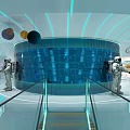 Futuristic Space Station Interior With Illuminated Central Door And Two Astronauts