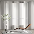 Contemporary Brown Lounge Chair Against Vertical Striped White Backdrop With Green Plant In Gray Pot