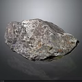 Raw Natural Mineral Rock With Multicolored Surface Texture And Reflective Base