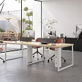 Open Public Office Space With Large Windows Red Chairs Green Plants And Outdoor Courtyard