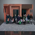 Group of People Standing in Front of Red Brick Building Holding Shopping Bags
