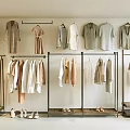 Clothes Hangers Displaying Neutral Tones Dresses Shirts And Coats In Retail Boutique