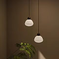 Modern Pendant Lights With White Textured Shades Brown Bases And Green Plant On Dark Wall