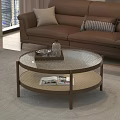 Round Coffee Table with Glass Top Brown Frame Woven Shelf Tray Water Bottle and Magazines