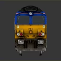 Blue InterCity Model Train Diesel Locomotive With Yellow Front On Reflective Surface