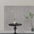 Modern Round Coffee Table With Dark Stone Tabletop Black Base White Pot And Green Plant