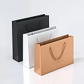 Three Colored Paper Shopping Bags with Handles in Black White and Brown