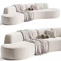 Cozy Beige Sectional Sofa With Curved Design Throw Blanket And Round Cushions