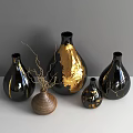Black Gold And Textured Brown Ceramic Vessels With Gold Accents And Dried Branches