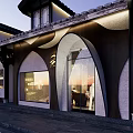 Traditional Chinese Storefront In Evening Featuring Wooden Panels Large Glass Windows And Eaves