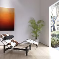 Modern Chaise Lounge In Bright Indoor Room With Orange Painting Potted Plant And Garden View