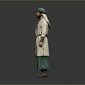 A man in green turban white robe green pants standing against gray background
