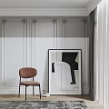 Brown Leisure Chair with Black Frame Stack of Books beside Abstract Painting on White Wall