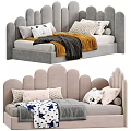 Children's Bed With Scalloped Headboard Multiple Pillows And Cozy Patterned Blankets