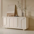 Modern Elegant White Entryway Cabinet Sideboard With Curved Lines Decorative Painting Vase and Green Plant