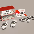 Multiple White Car Models Display With Red Roof Cabinet And Brochure Around