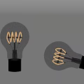 Two Vintage Spiral Filament Light Bulbs Standing And Tilted With Transparent Glass