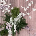 Wedding Scene With Couple Pink Backdrop White Butterflies Purple Flowers And Green Plants