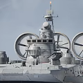Military Hovercraft With Large Rotating Fans Radar System And Cannons On Water