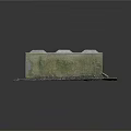 Weathered Concrete Block With Moss Covered Surface And Gravel Dirt Base