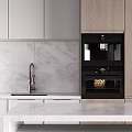 Modern Kitchen Interior With White Cabinets Marble Backsplash Range Hood And Island Counter