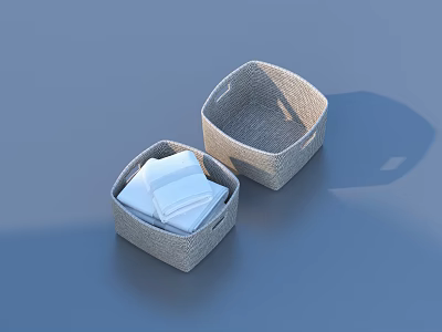 Two Gray Wicker Storage Baskets With Folded White Cloths For Home Organization 3d model