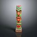 Scenic Landscape With Totem Pole Having Three Green And Red Faces On Wooden Base