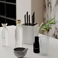 Stylish Kitchen Tabletop With Glass Bottles Knife Set Green Plant And Glass Cup