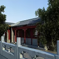 Ancient Chinese Architecture With Gray Tiled Roof Red Doors Windows Surrounding Trees And Stone Balustrade