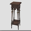 Indoor Green Plants Display On Wooden Plant Stand With Decorative Carved Leg Design