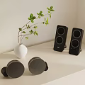 Minimalist Shelf Display With White Vase Green Plant Black Speakers Gray Items