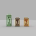 Decorative Ornaments Set Featuring Three Geometric Hourglasses In Green Brown And Amber Transparent Design