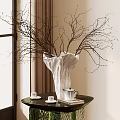 White Textured Vase With Decorative Twig Branches On Round Table With Tea Set And Curtains