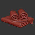Bathroom With Soft Rolled And Folded Brown Towels Neatly Arranged