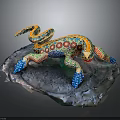 Colorful Painted Lizard Sculpture With Vibrant Patterns On Rock Base
