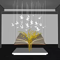 Interior Open Book Art Installation Featuring Yellow Decorations And Hanging White Birds