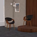 Modern Black Leather Dining Chairs With Wooden Legs Against Grey Walls And Artwork
